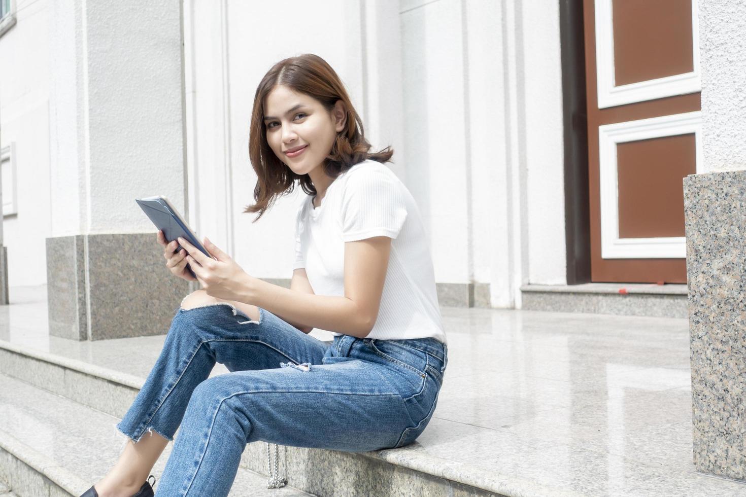 University student is holding tablet photo