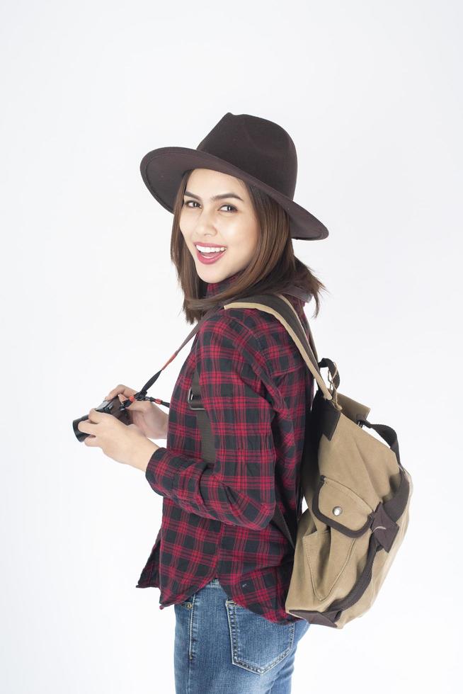Beautiful traveller woman on white background photo