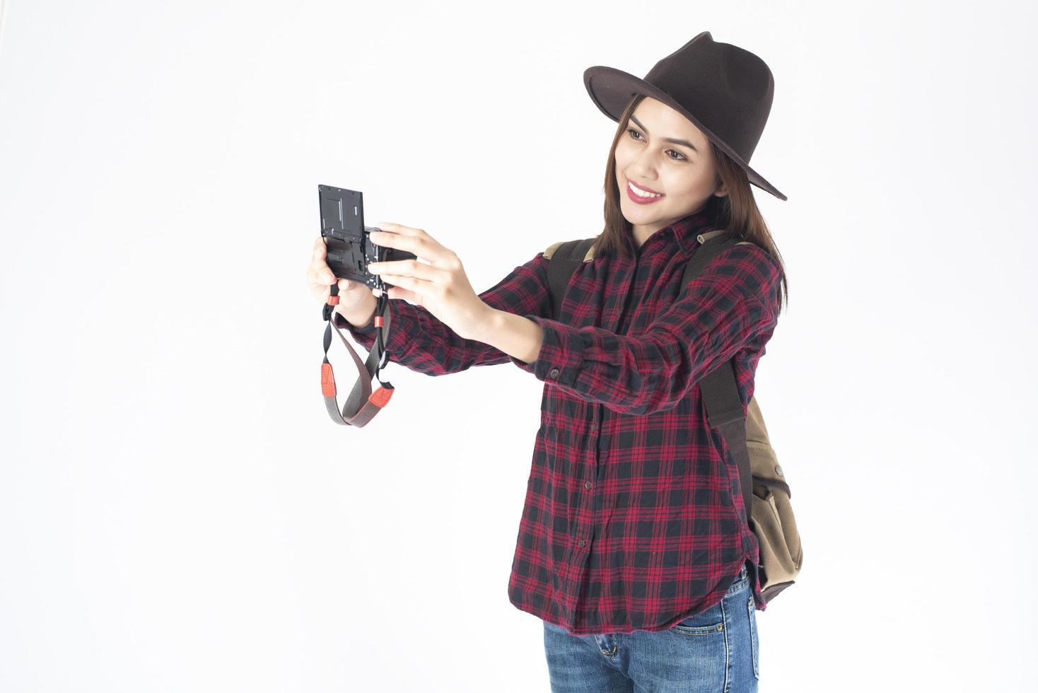 Beautiful traveller woman on white background photo