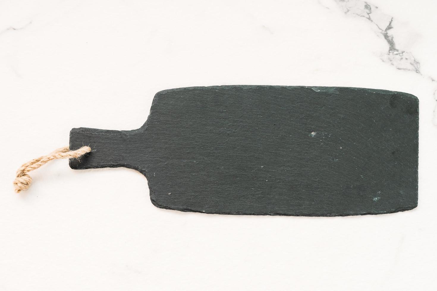 Slate on white marble stone photo