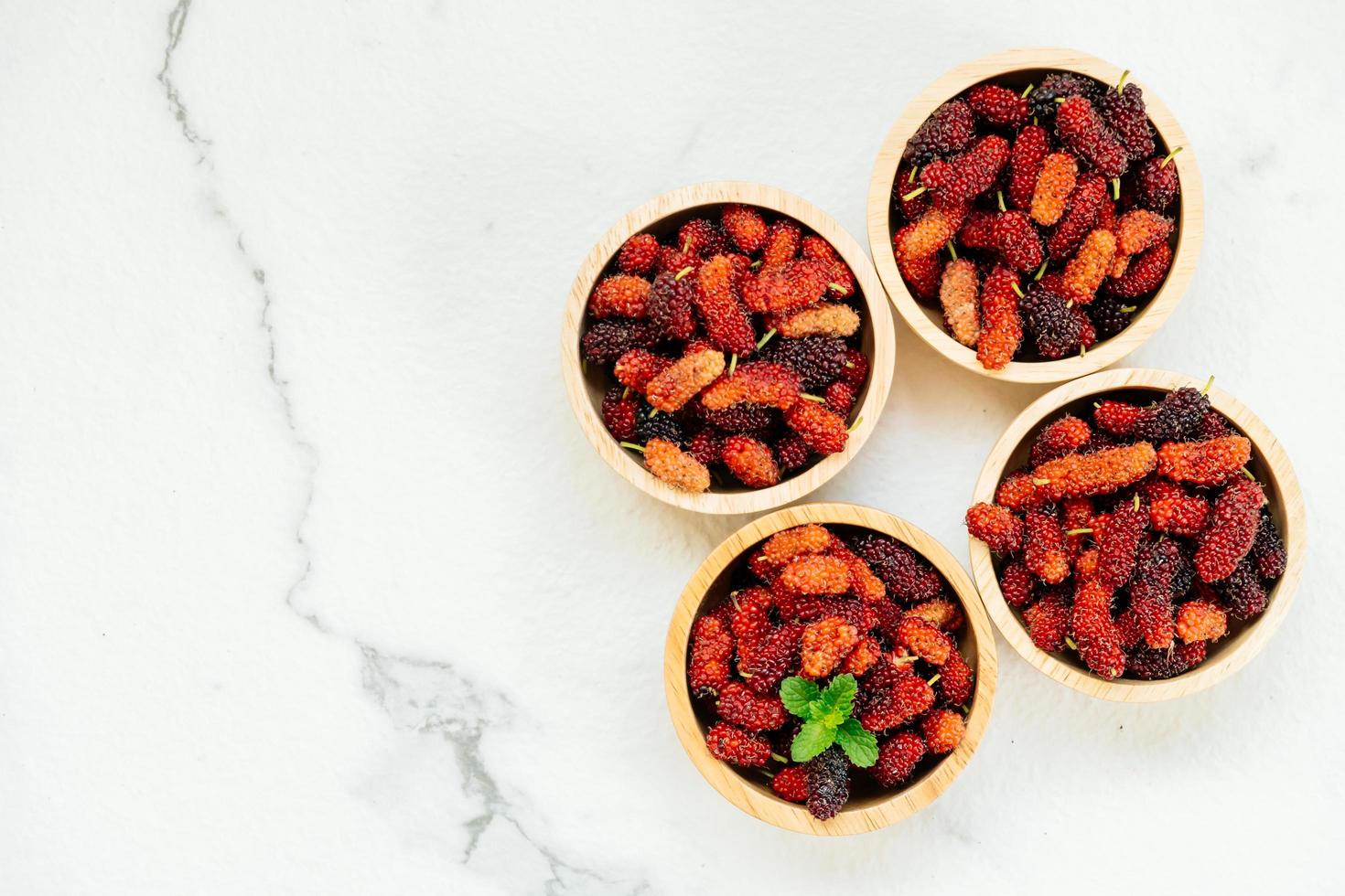 Black mulberry fruit in bowl photo