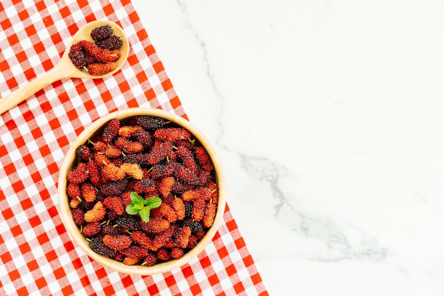 Black mulberry fruit in bowl photo