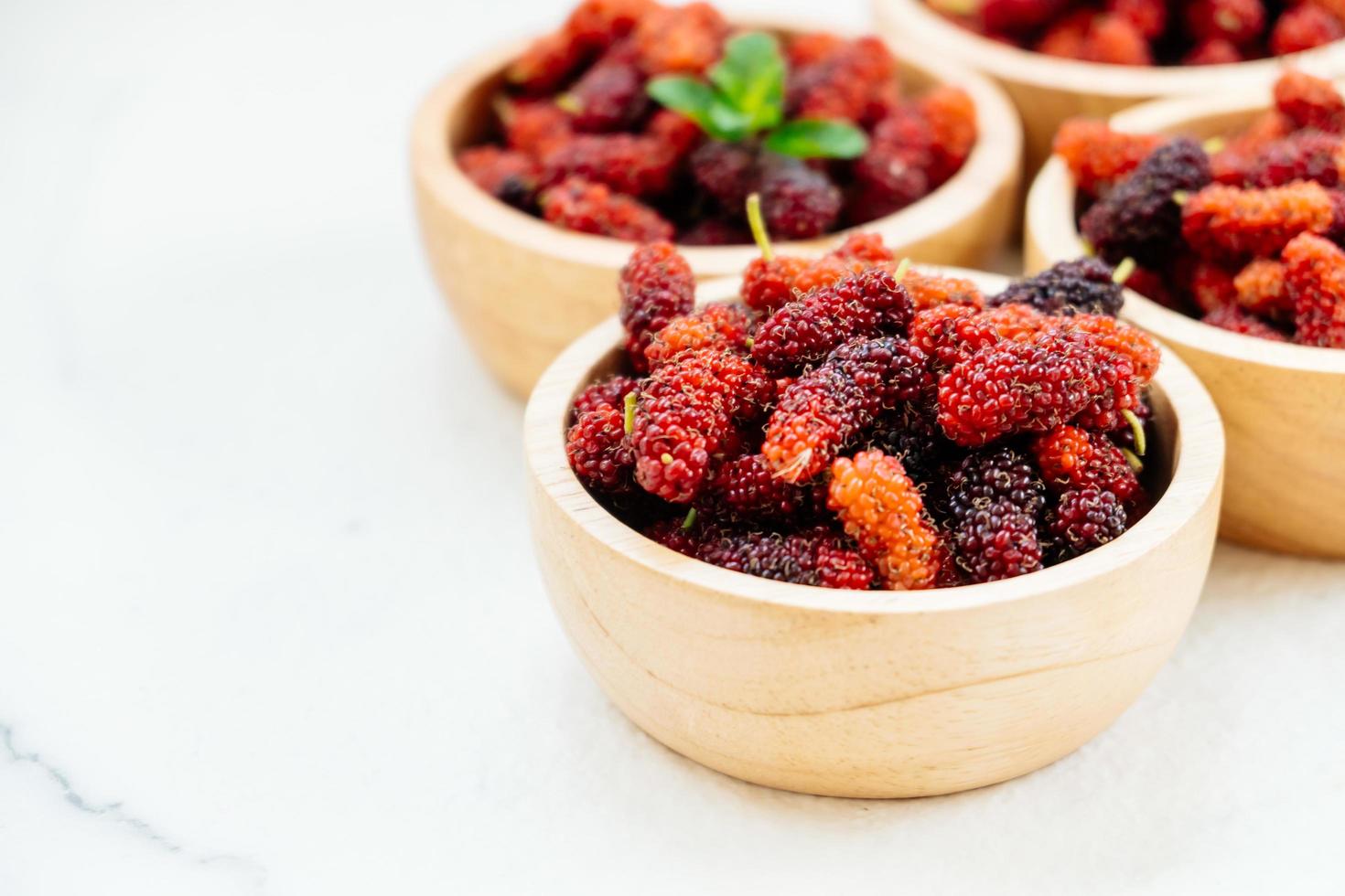 Black mulberry fruit in bowl photo