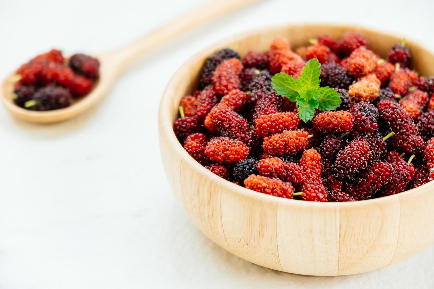 Black mulberry fruit in bowl photo