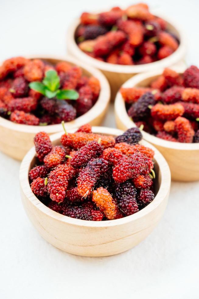 Black mulberry fruit in bowl photo