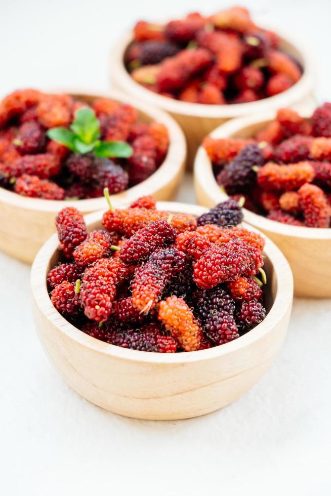 Black mulberry fruit in bowl photo