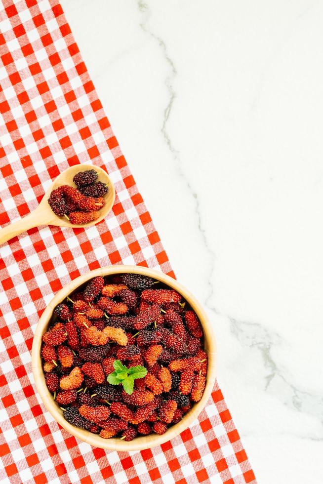 Black mulberry fruit in bowl photo