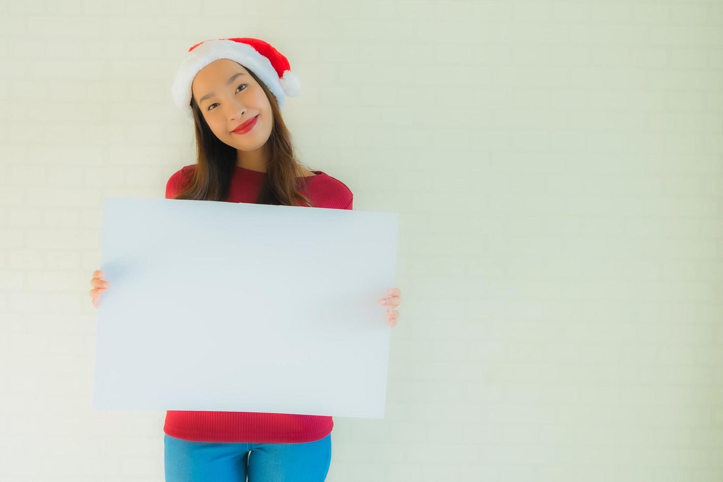 Portrait beautiful young asian women show blank white board card with copy space photo