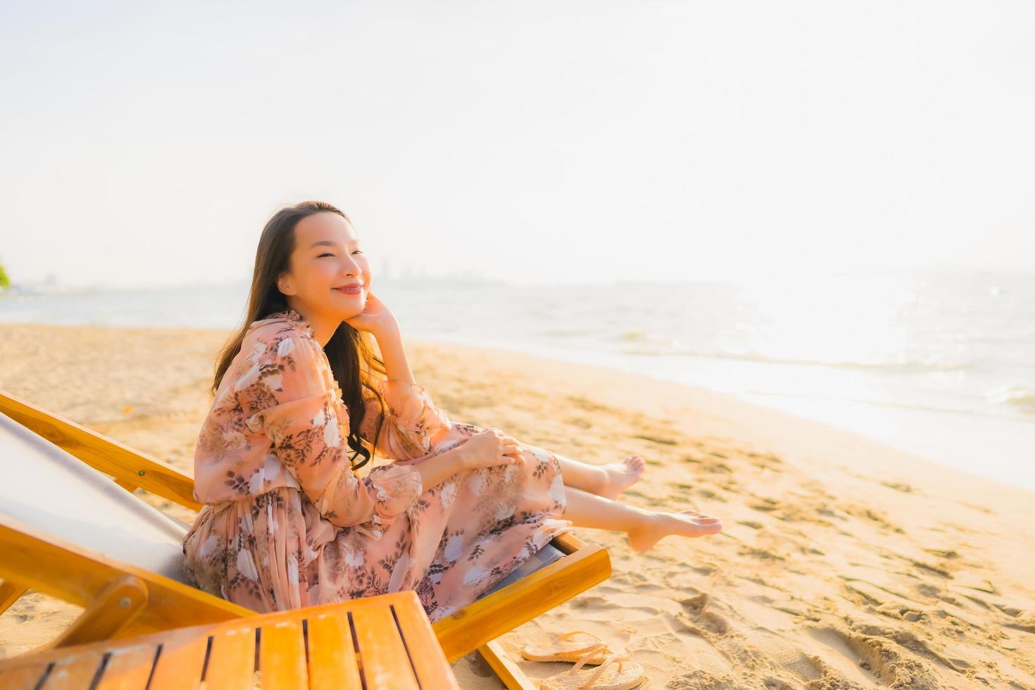 Portrait beautiful young asian women happy smile around outdoorn happy smile relax around tropical beach sea photo