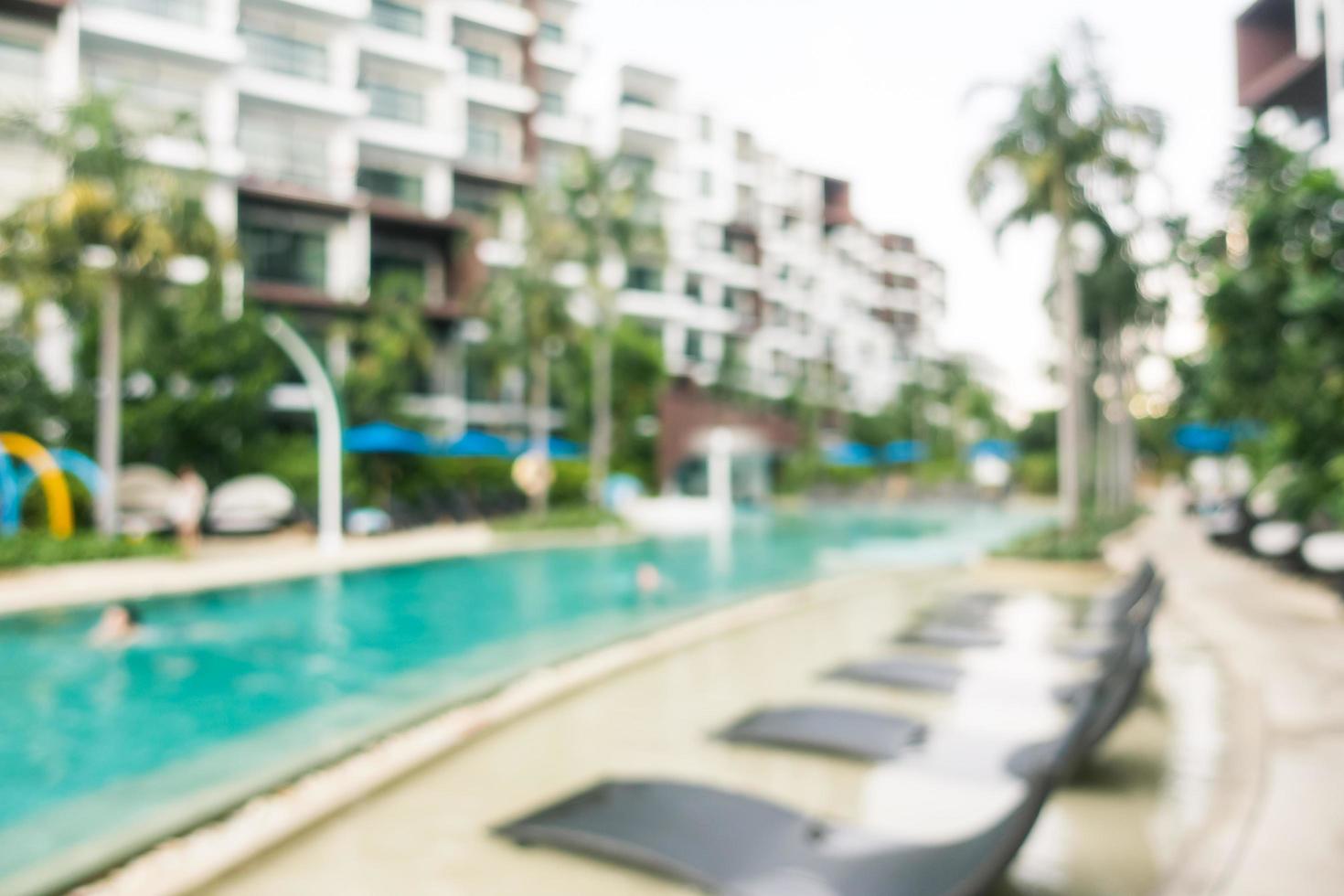 Abstract blur and defocused swimming pool in hotel and resort photo