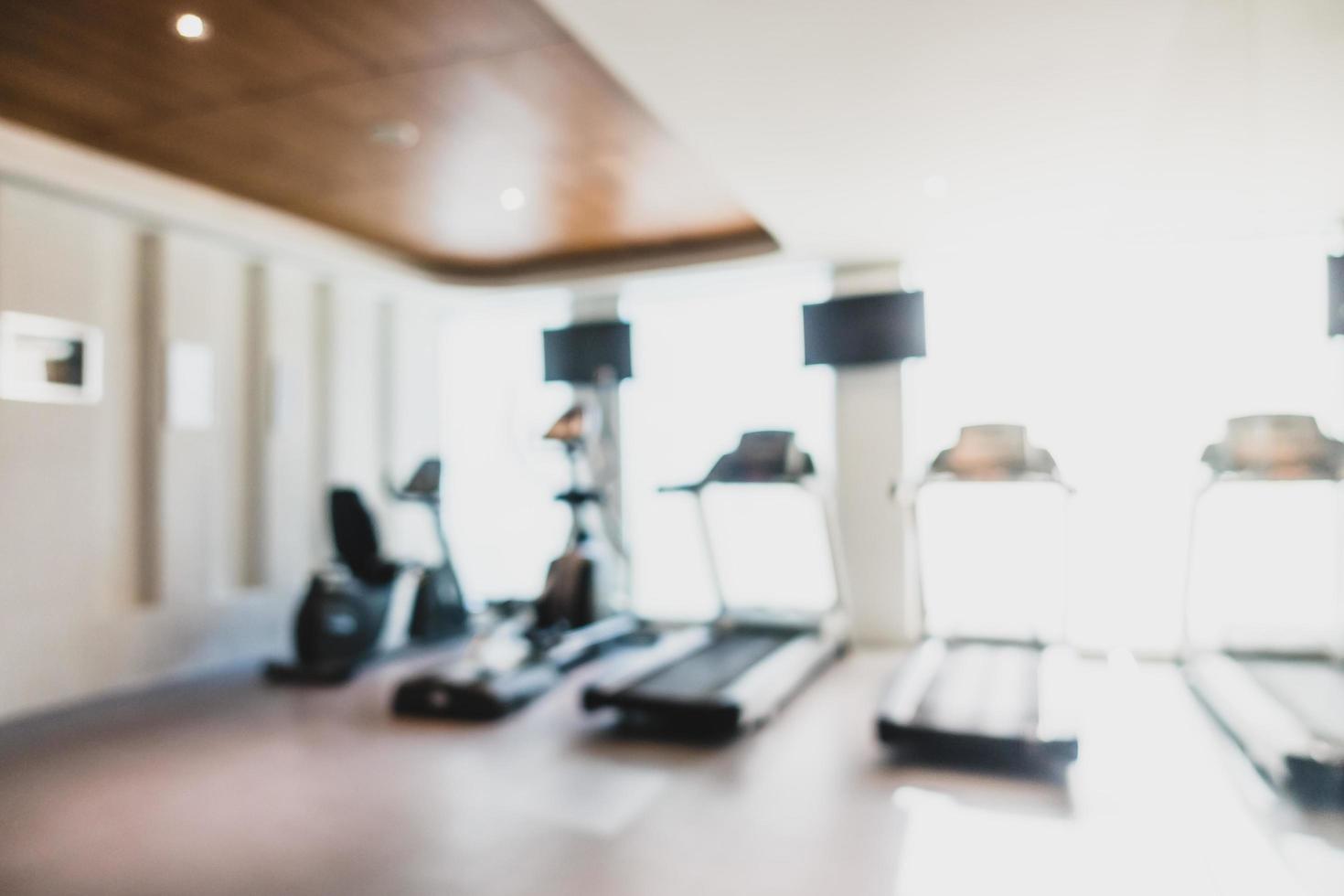 Abstract blur and defocused fitness equipment in gym interior photo