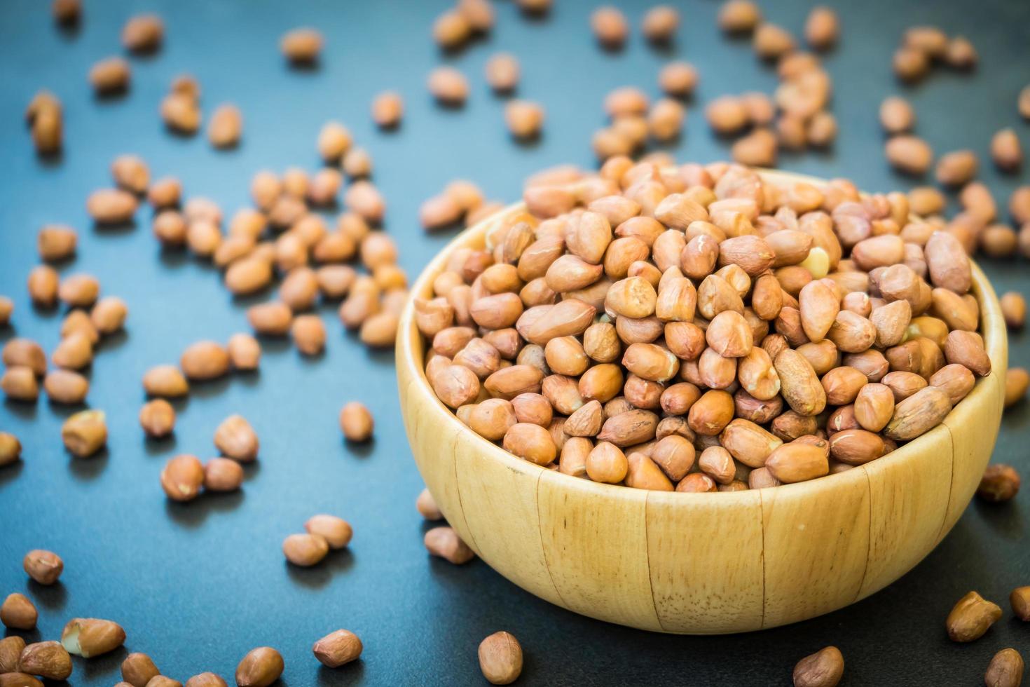 Peanuts in wooden bowl photo