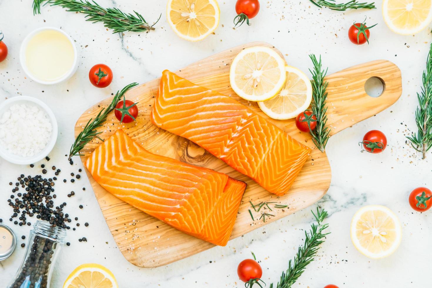 Raw and fresh salmon meat fillet on wooden cutting board photo