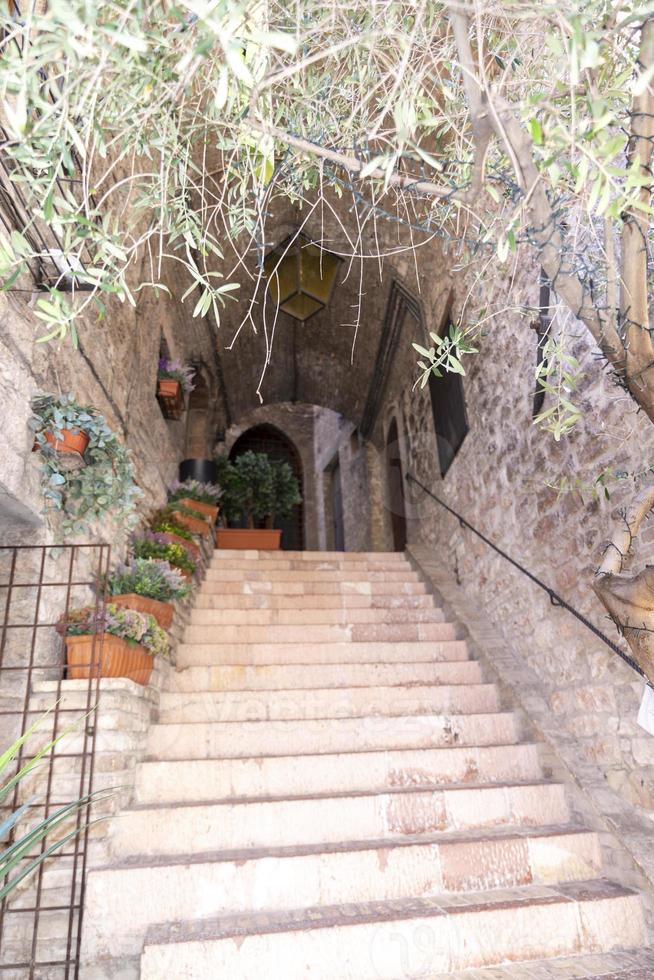 Architecture of streets and buildings in the historic center of assisi photo