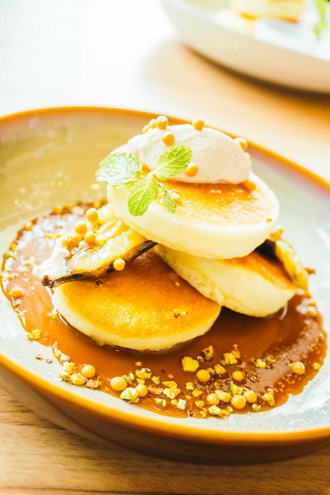 Sweet dessert pancake with banana and sweet sauce photo