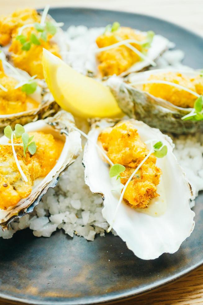 Fried oyster shell with sauce photo