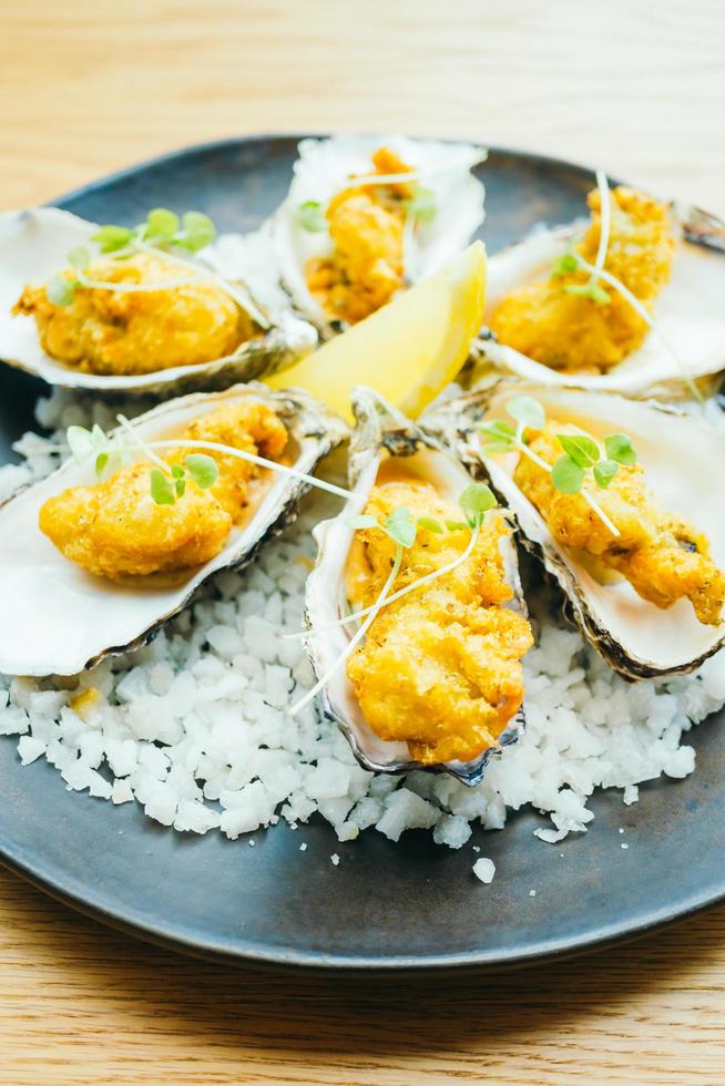 Fried oyster shell with sauce photo