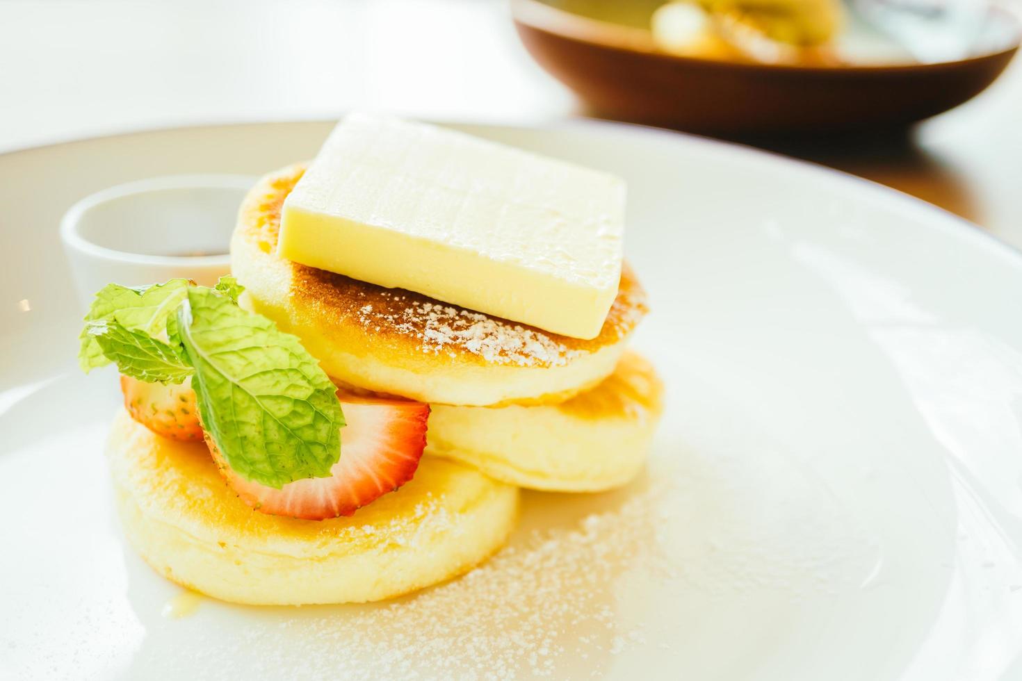 Sweet dessert pancake with butter and strawberry photo