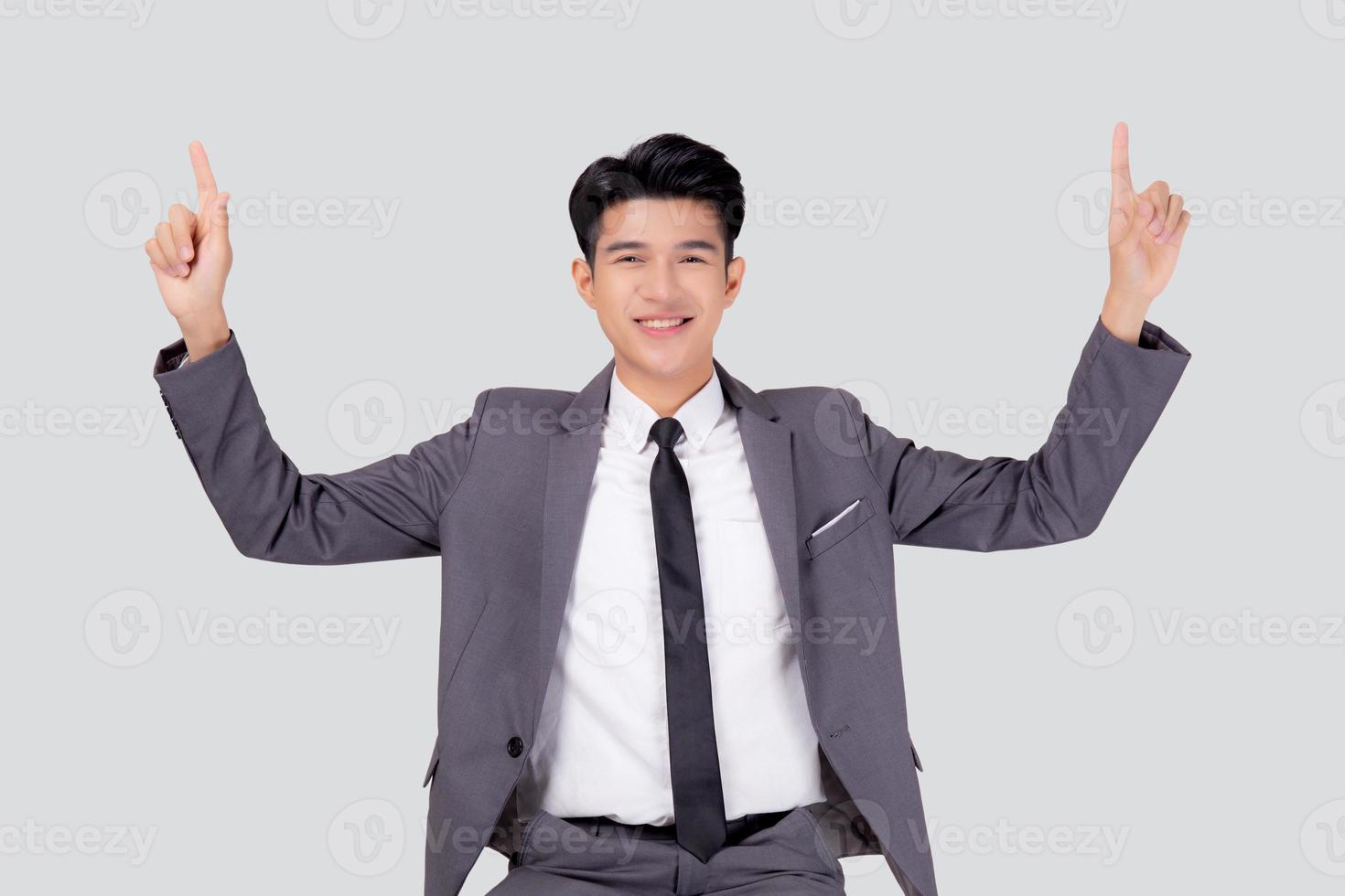 Portrait young asian business man pointing and presenting isolated on white background, advertising and marketing, executive and manager, male confident showing success, expression and emotion. photo