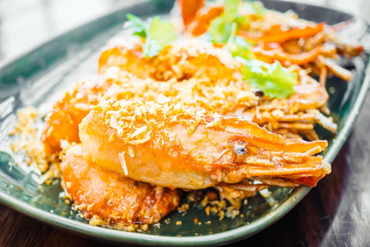 Fried prawn with garlic in plate photo