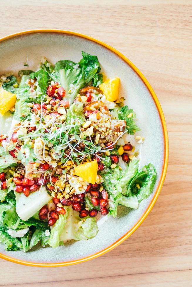 Grilled chicken with vegetable and pomegranate , fruits salad in plate - Color Filter Processing photo