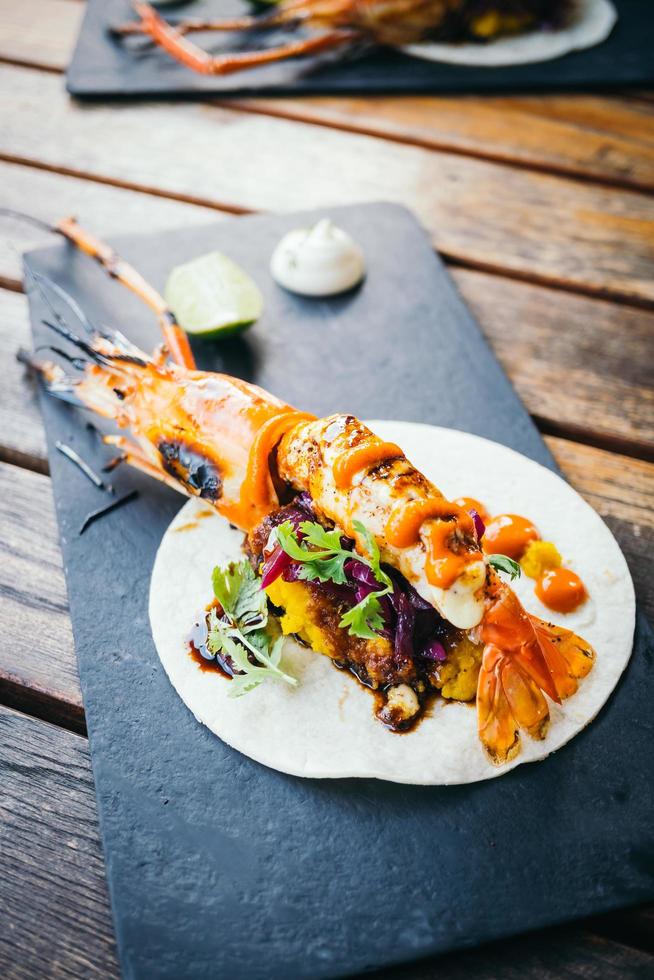Taco with prawn or shrimp and sauce photo
