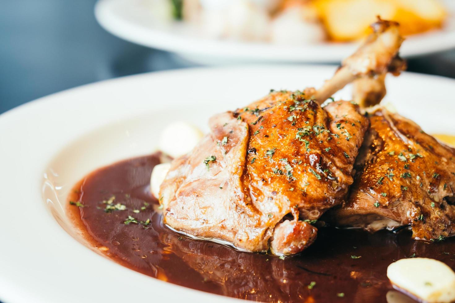 Duck breast steak in white plate photo