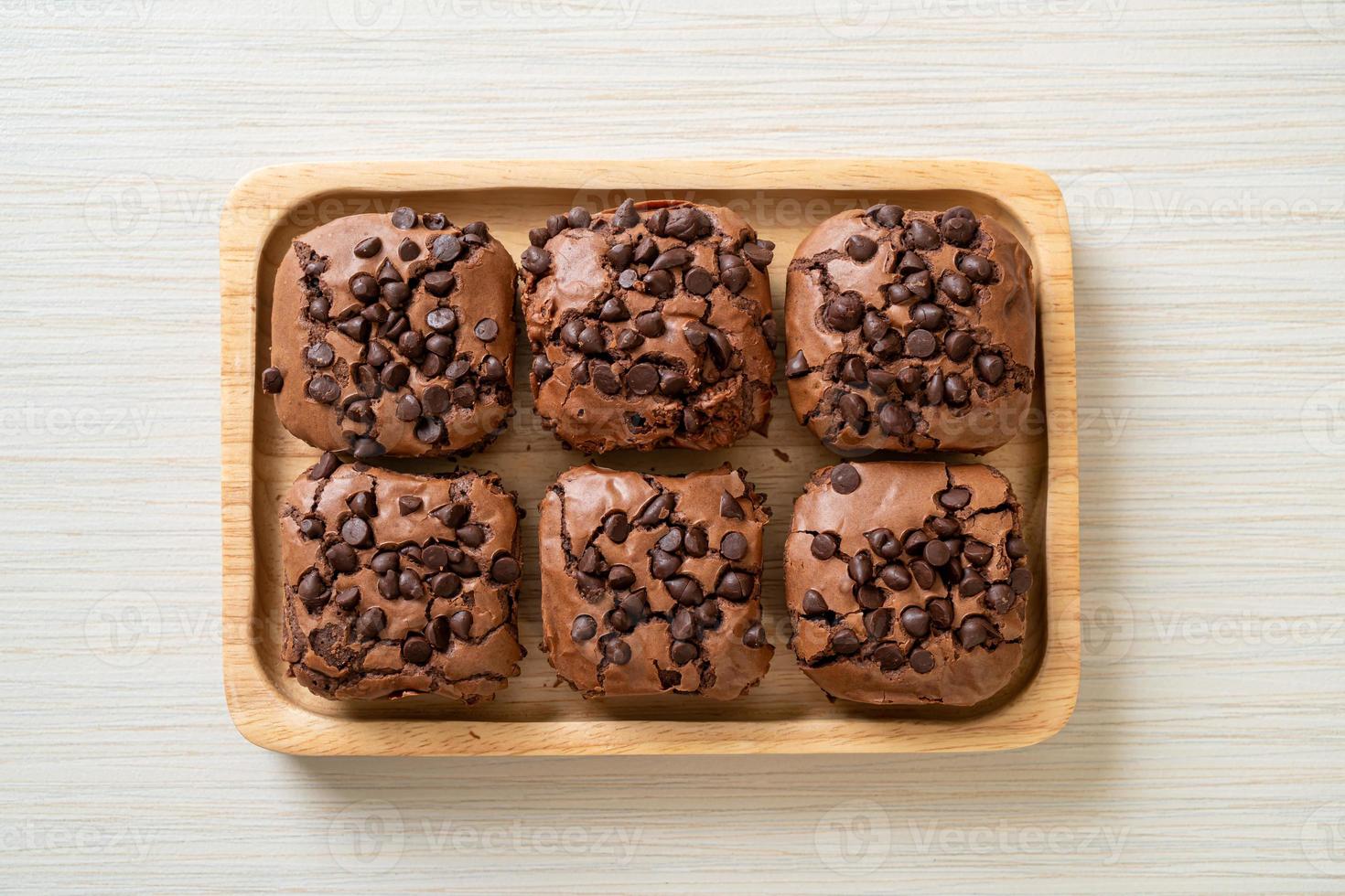 Dark chocolate brownies with chocolate chips on top photo