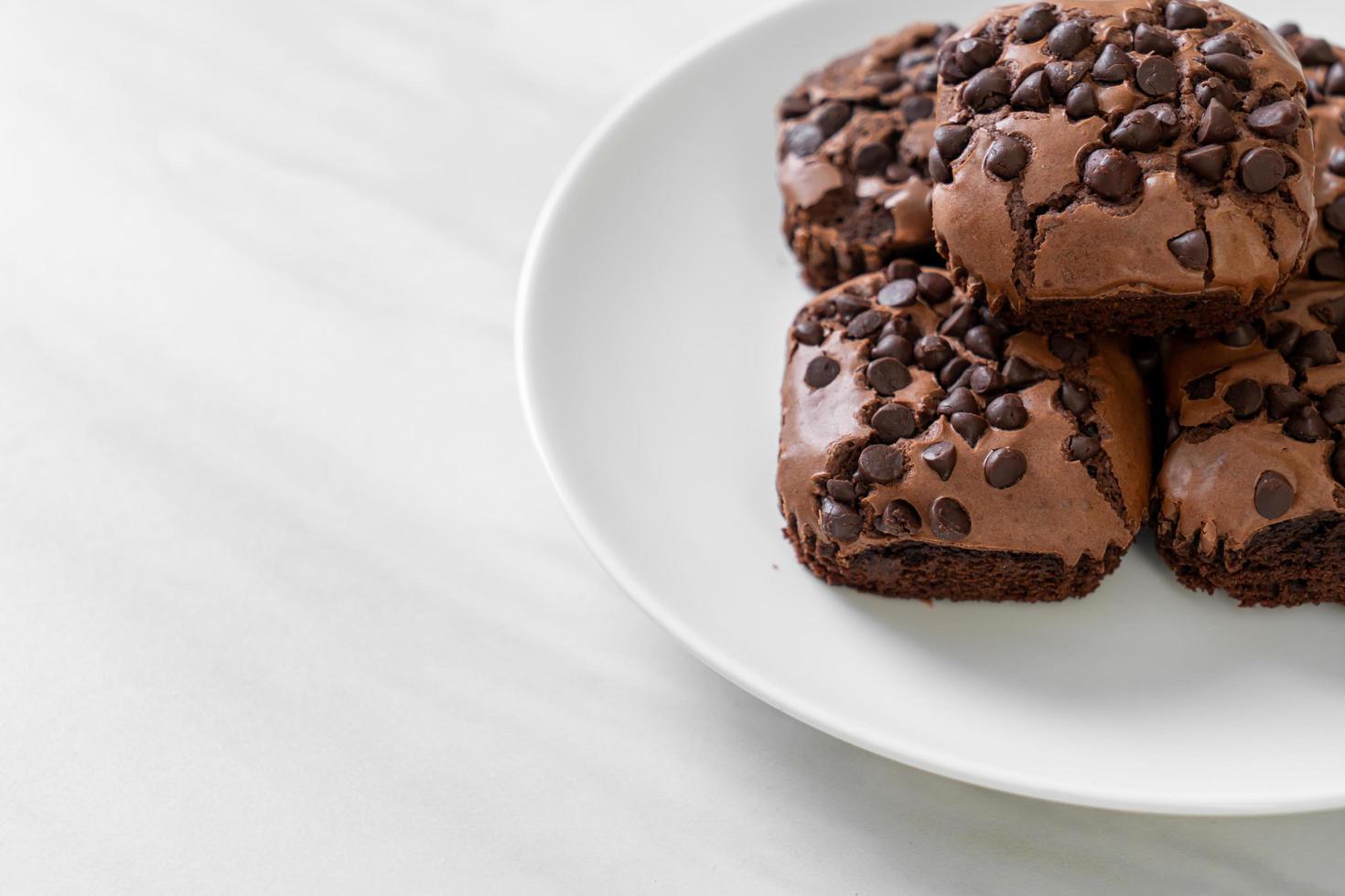 Dark chocolate brownies with chocolate chips on top photo