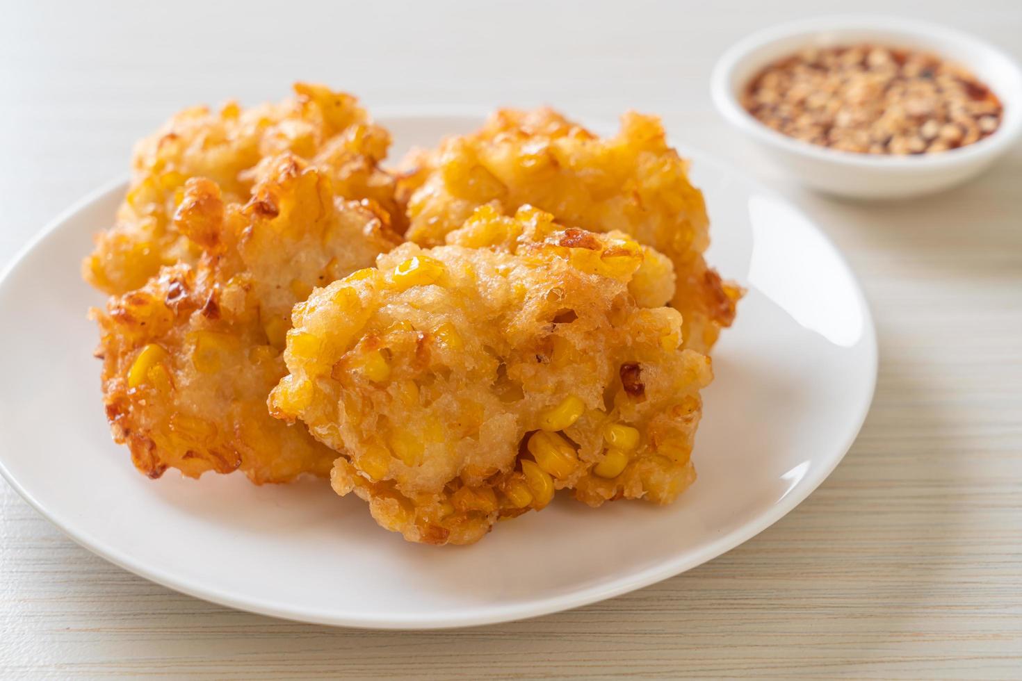 Deep-fried corn with sauce - vegan and vegetarian food style photo