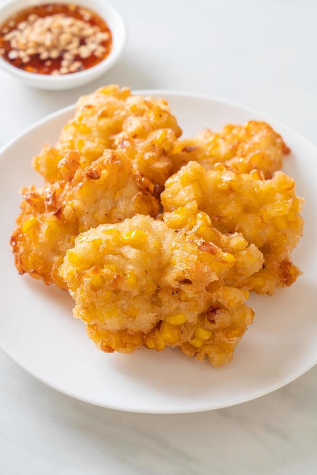 Deep-fried corn with sauce - vegan and vegetarian food style photo