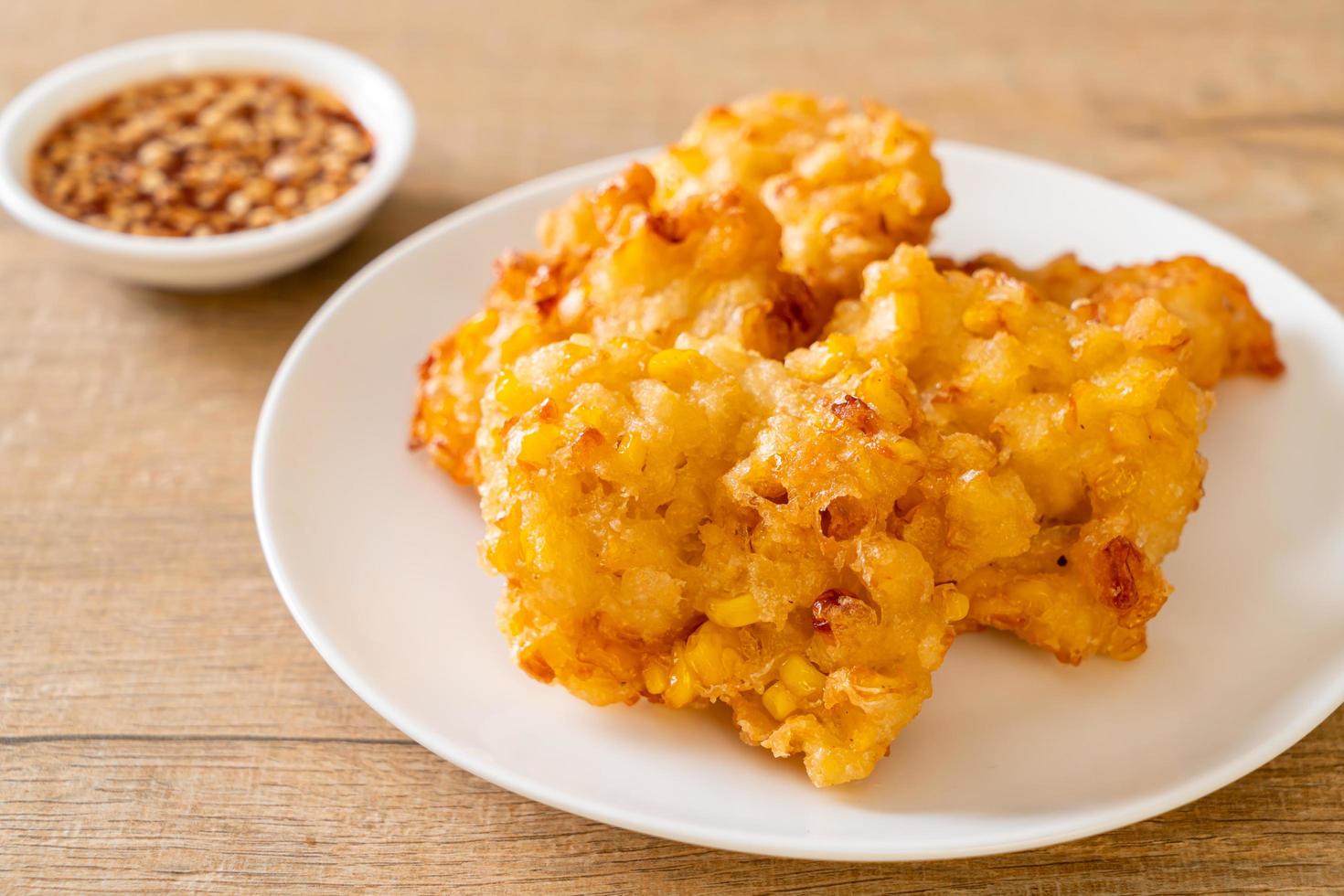 Deep-fried corn with sauce - vegan and vegetarian food style photo