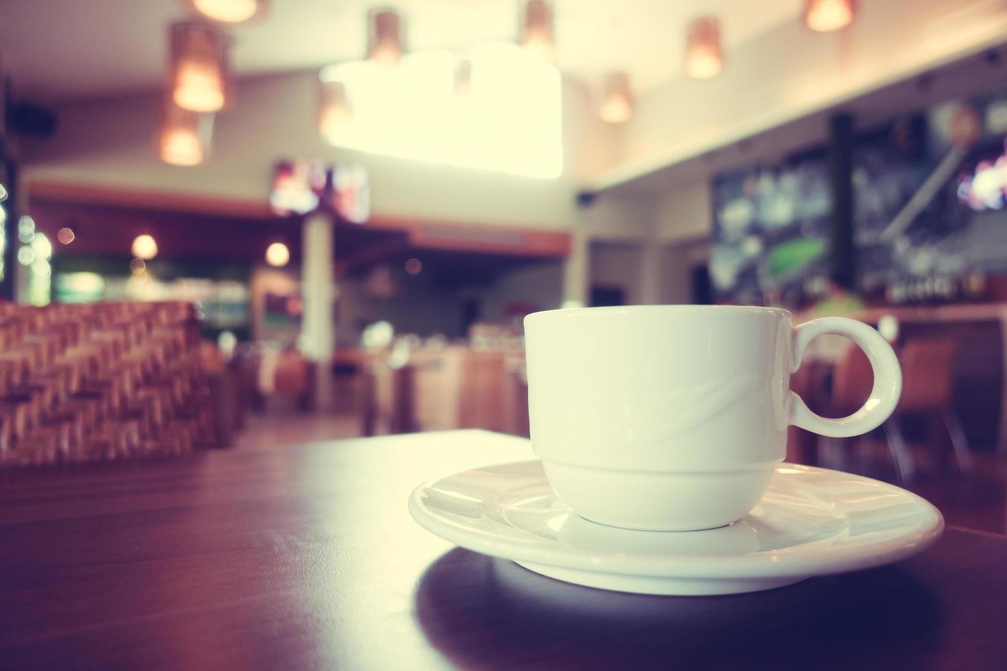 White coffee cup in coffee shop cafe photo