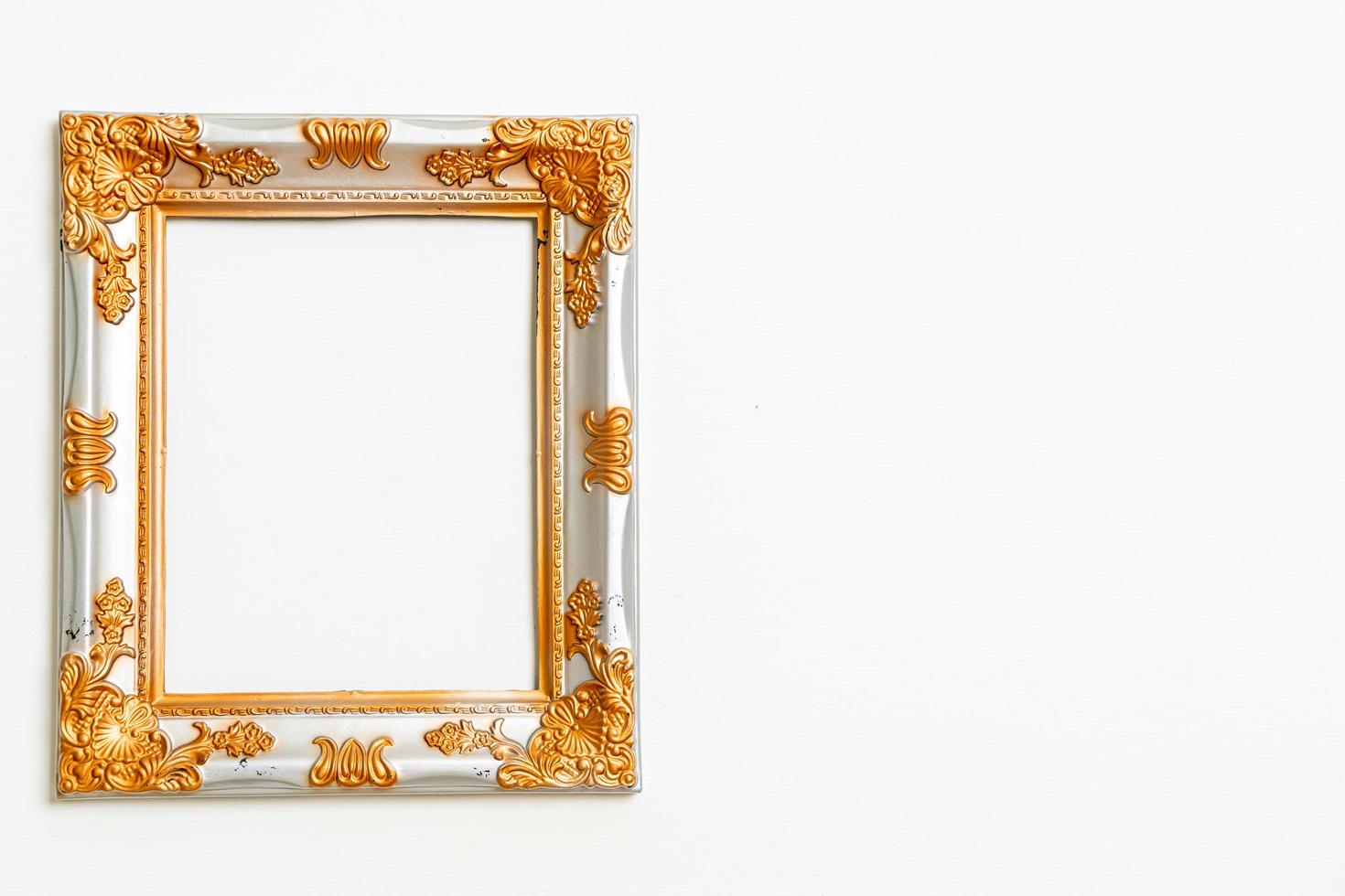 Empty picture frame on white wall background with copy space photo