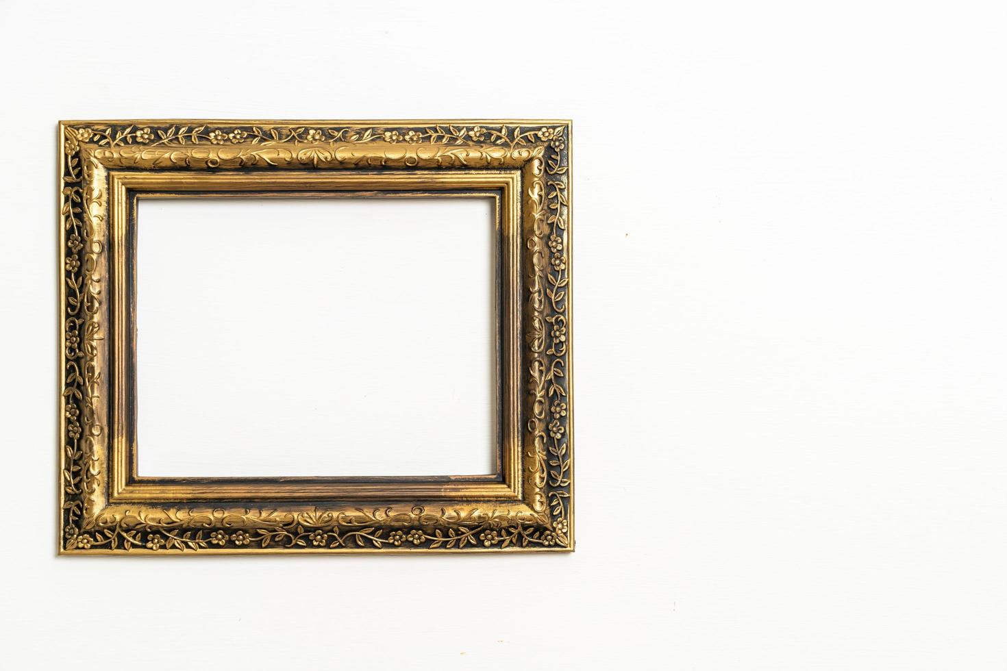 Empty picture frame on white wall background with copy space photo