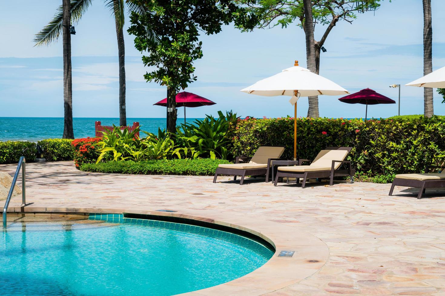 Bed pool around swimming pool in hotel resort - holiday and vacation concept photo