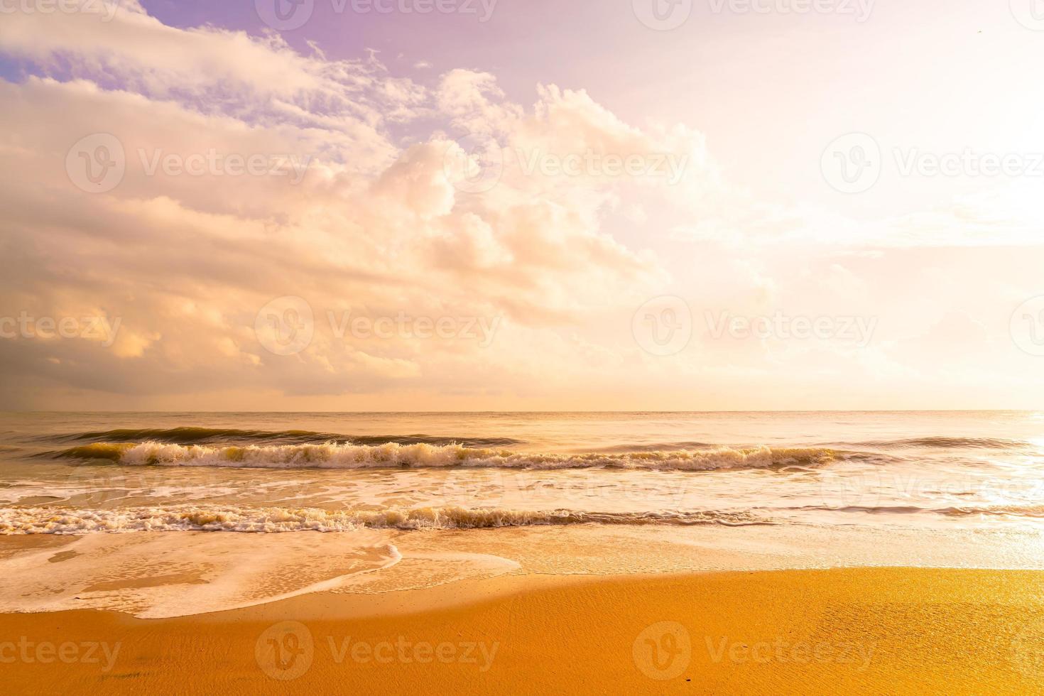 Beautiful and empty beach sea at sunrise or sunset time photo