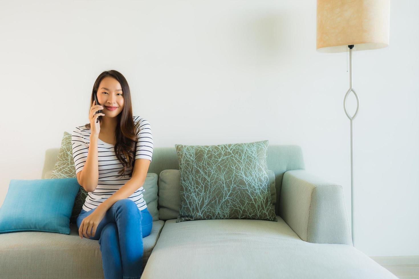 Portrait beautiful young asian woman using or talking mobile phone photo