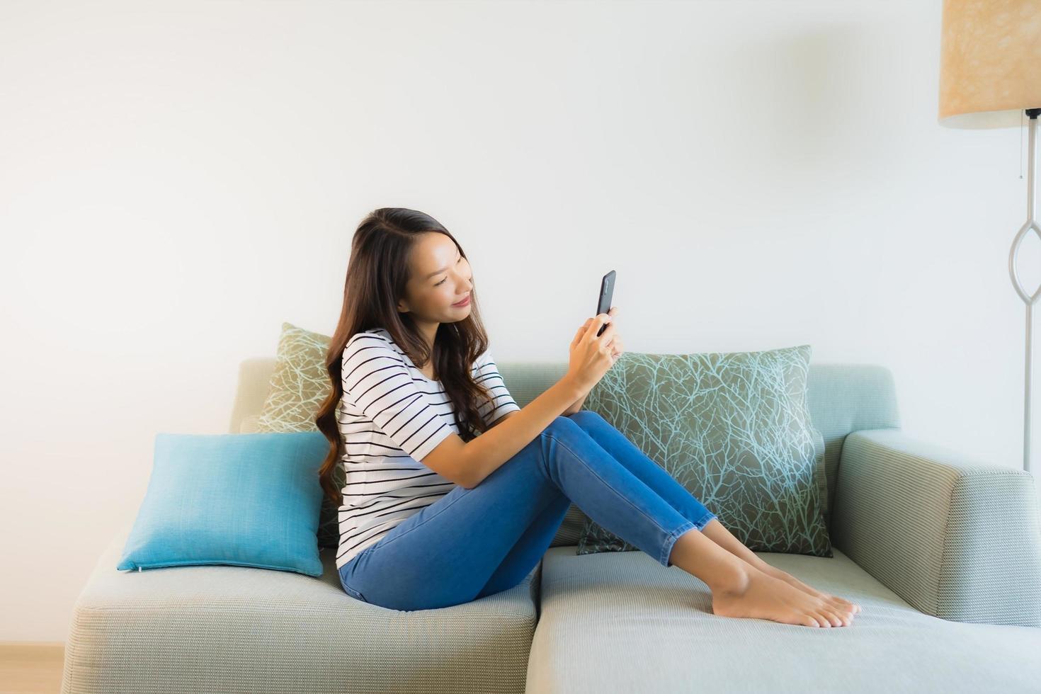 Portrait beautiful young asian woman using or talking mobile phone photo