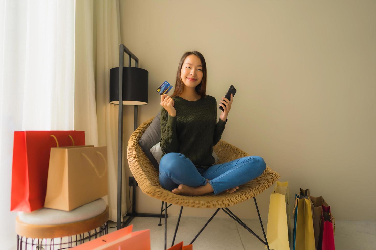 Portrait beautiful young asian women using computer laptop or smart and mobile phone with credit card for online shopping photo