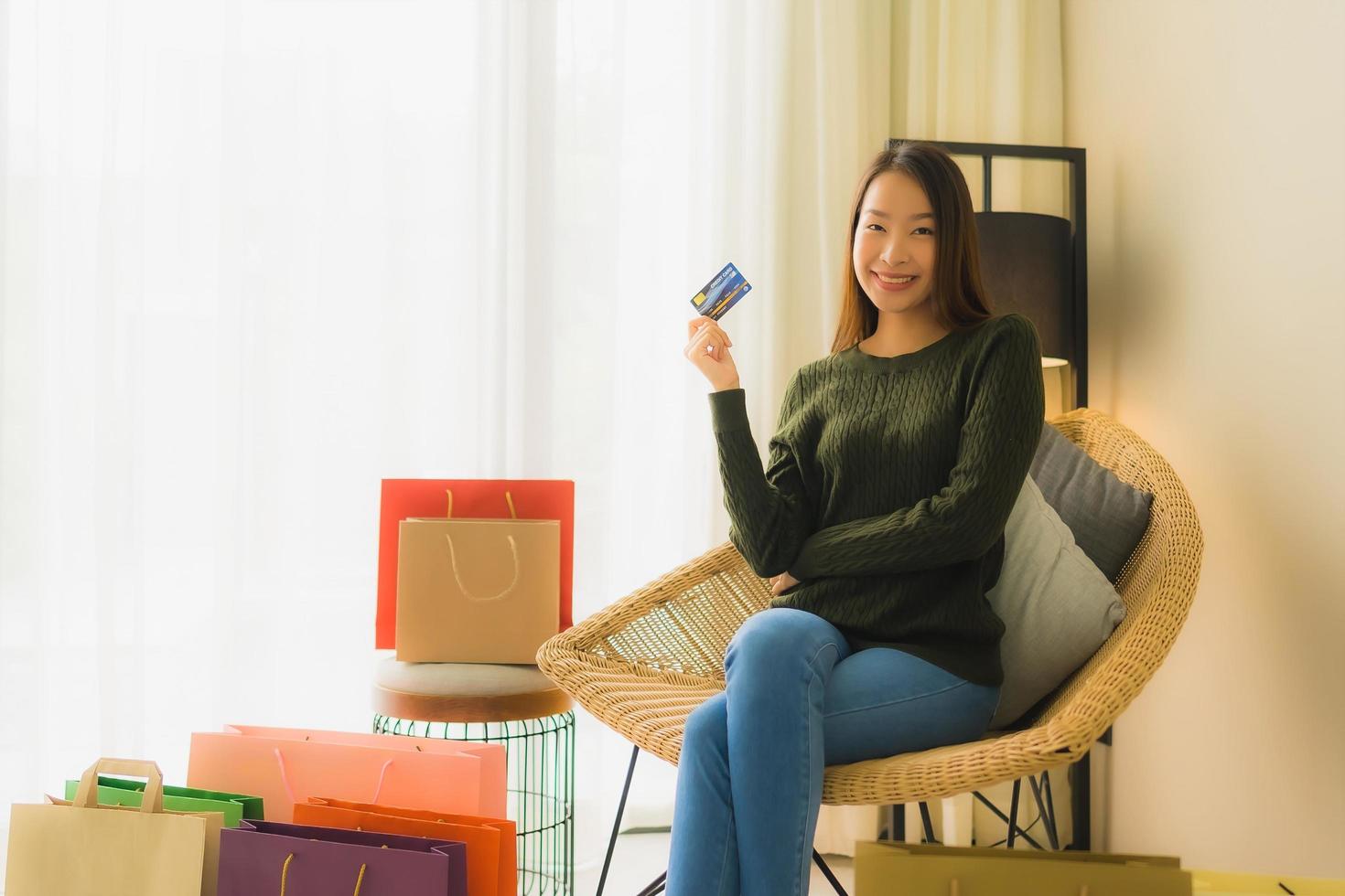 Portrait beautiful young asian women using computer laptop or smart and mobile phone with credit card for online shopping photo
