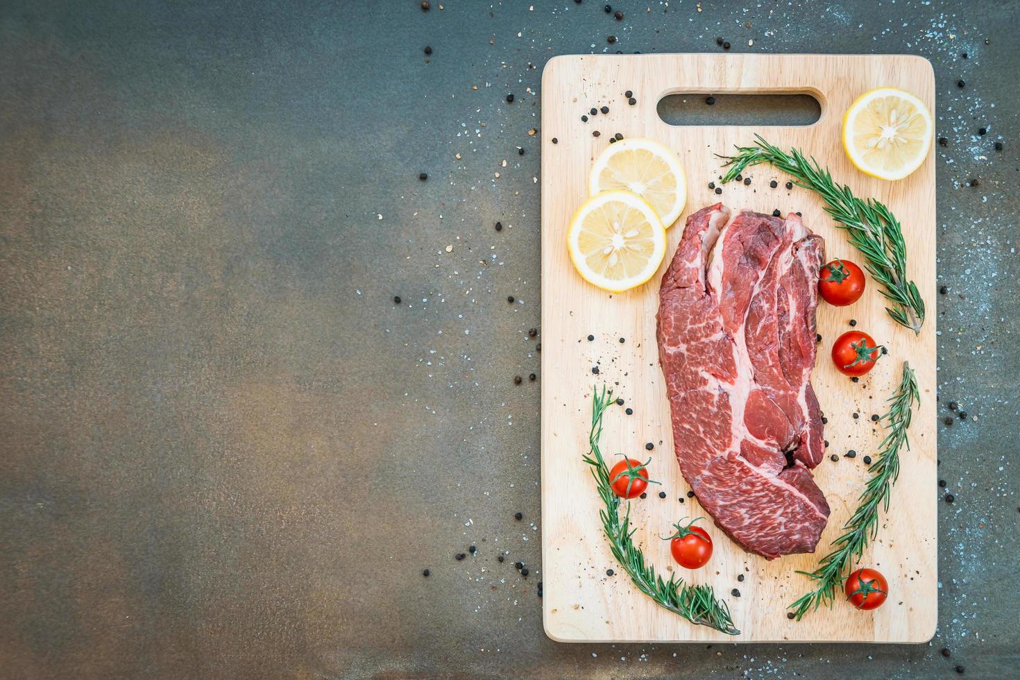 Raw beef meat on cutting board photo