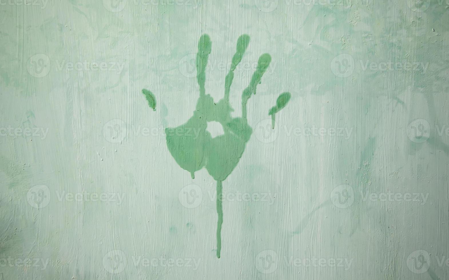 Hand mark on a wall photo