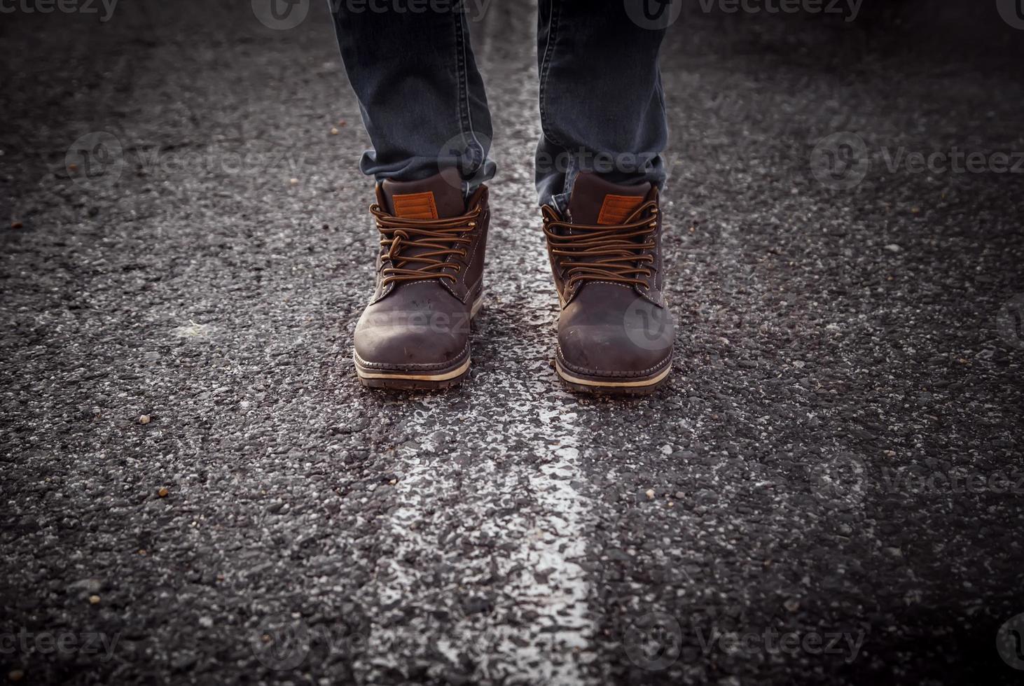 Men's boots in a forest photo