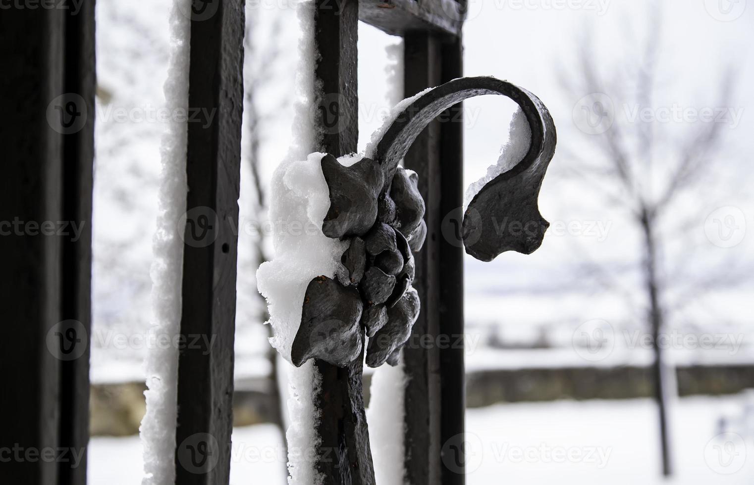Metal railing full of snow photo
