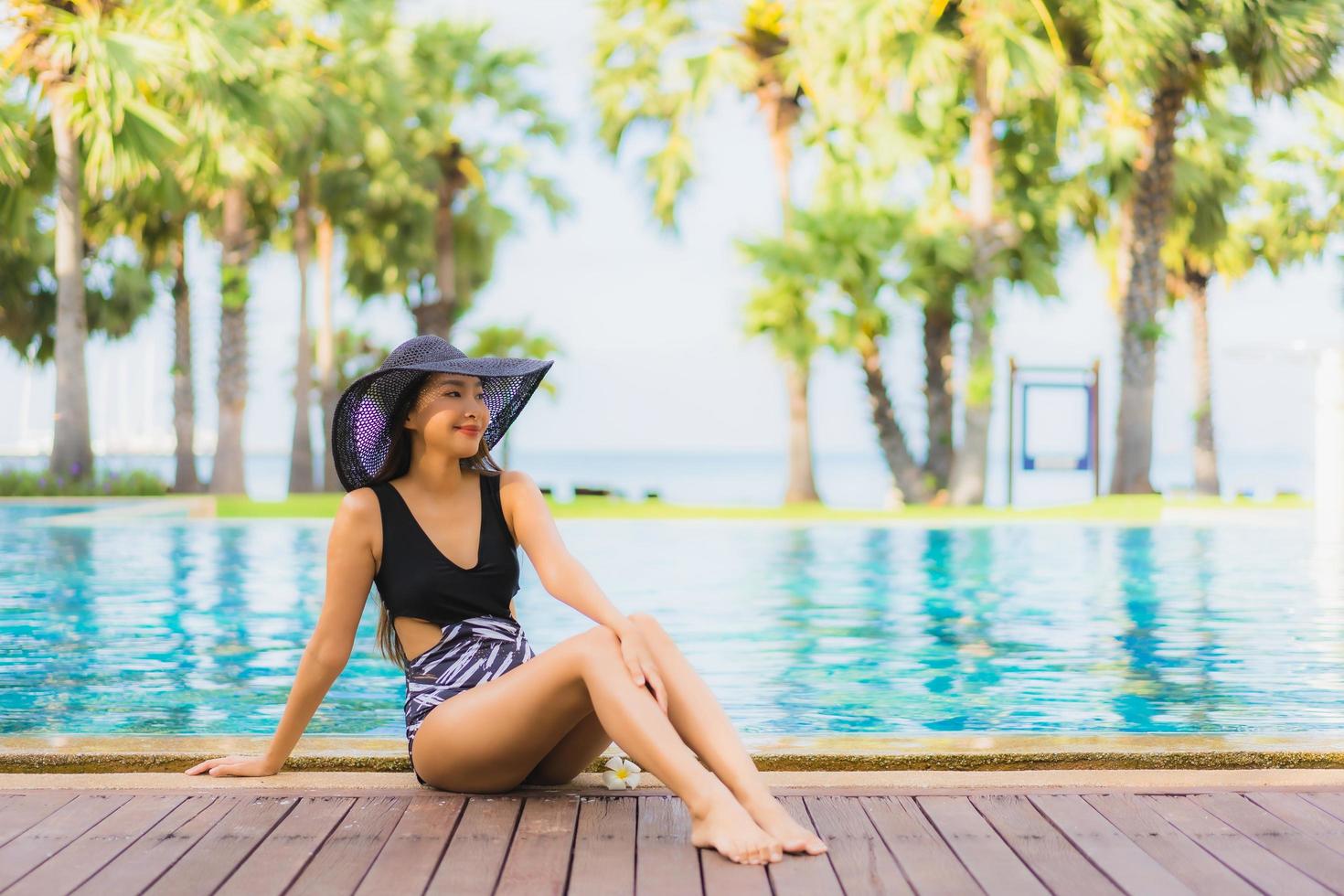 Portrait beautiful young asian women happy smile relax around swimming pool photo