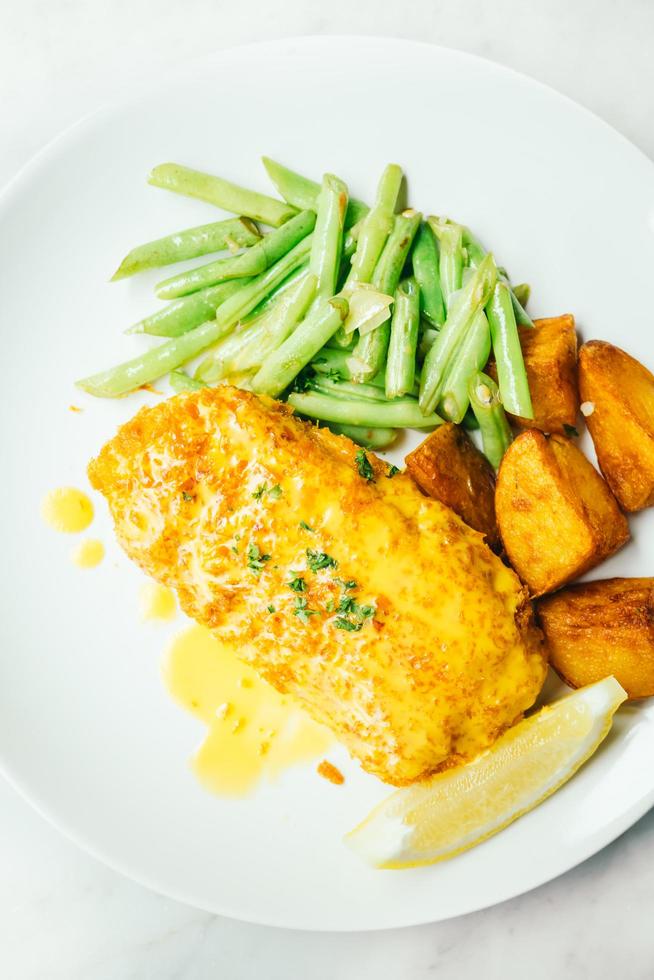 Fried chicken steak with lemon and vegetable photo