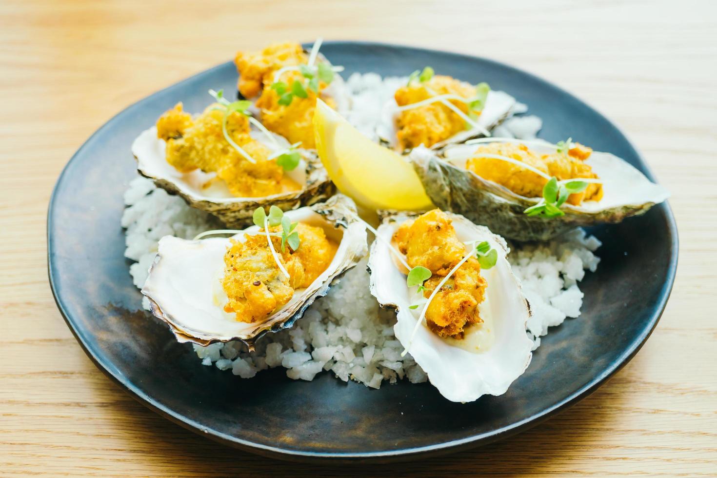 Fried oyster shell with sauce photo