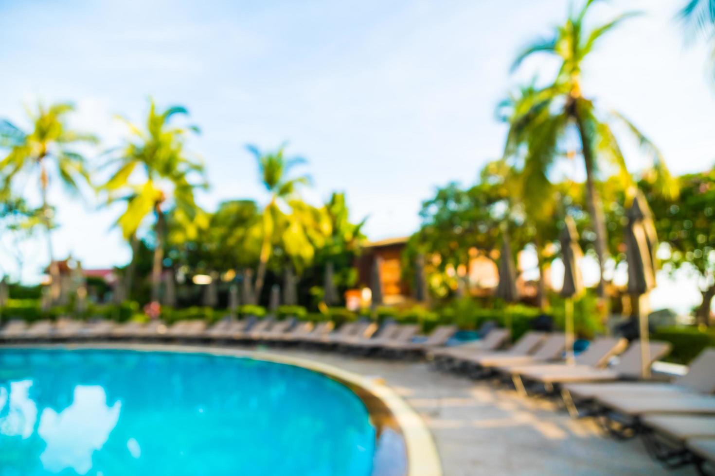 Silhouette coconut palm tree around swimming pool photo