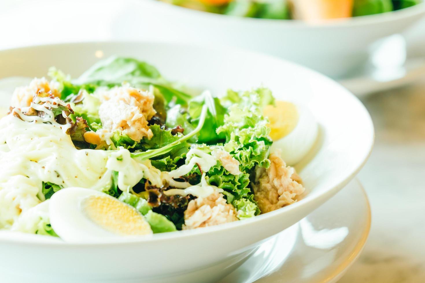 Fresh tuna salad in white bowl photo